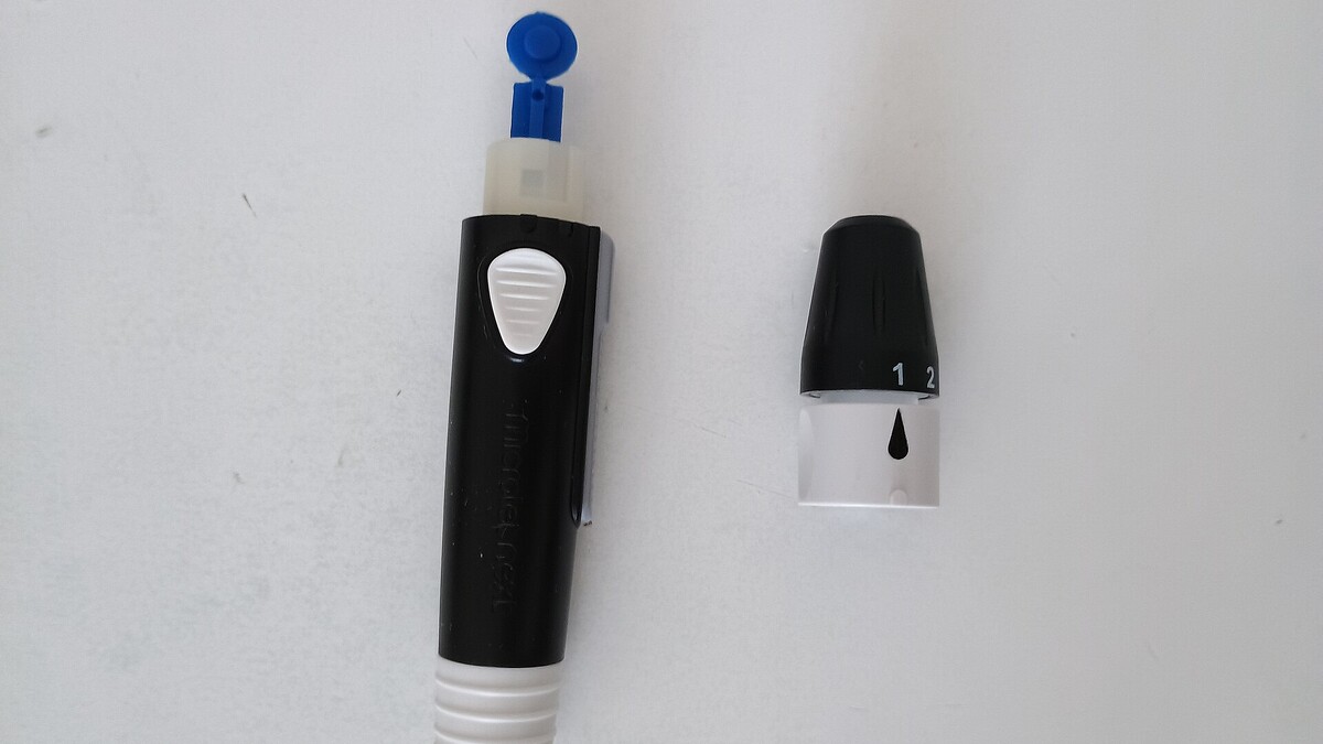 Lancetador usado para coletar gota de sangue no teste de glicemia